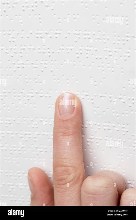 Blind person reading braille Stock Photo - Alamy