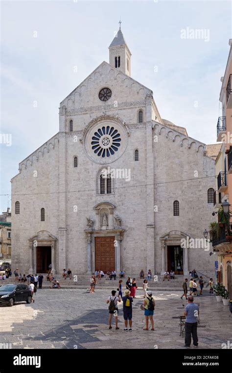 People at Bari Cathedral in Bari, Apulia, Italy. The cathedral was ...