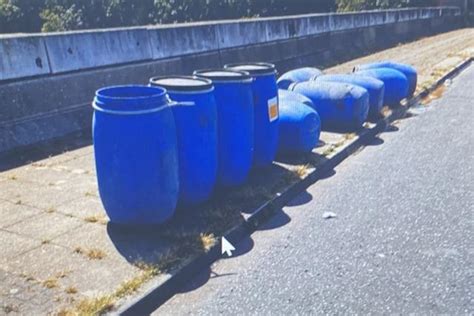 Nearly a dozen barrels of ‘toxic acid’ dumped by side of east London road