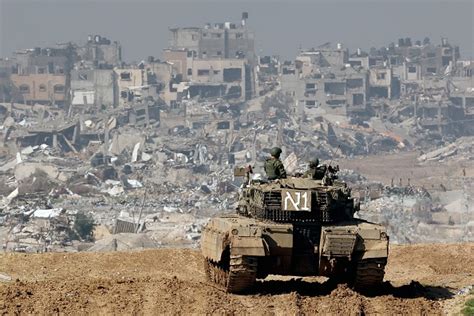 Israel to create Gaza buffer zone by 'destroying enclave'