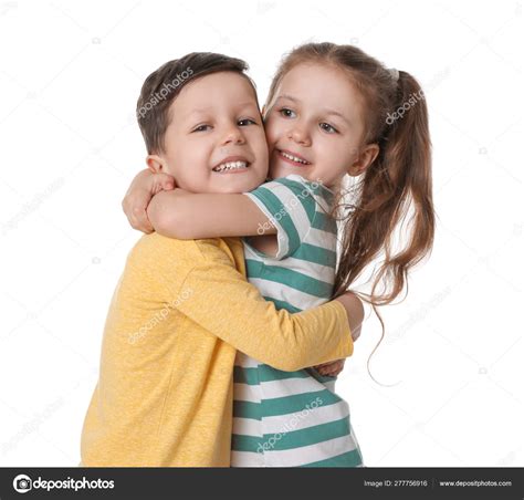 Cute little boy and girl hugging on white background Stock Photo by ...