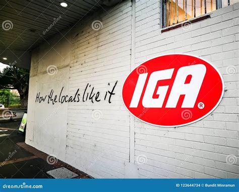 IGA Australian Supermarket Group Brand Logo on a Wall with Slogan `How ...