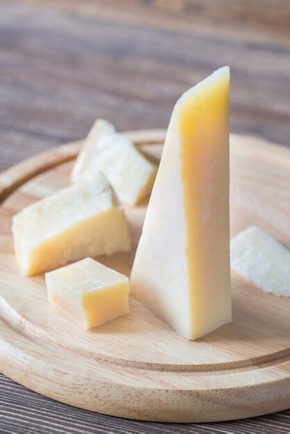 Premium Photo | Grana padano cheese on the wooden board