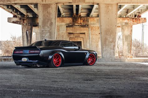 Blacked Out Dodge Challenger SRT with Custom Red Wheels