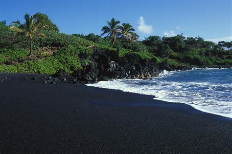 Black Volcanic Sand Beach On Hawaiis Photograph by Paul Nicklen