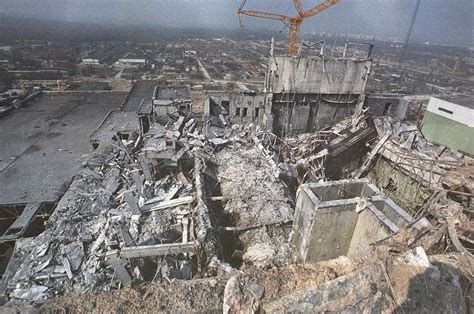 A closeup of the damage to Unit 4, photographed from the roof of Unit 3 ...