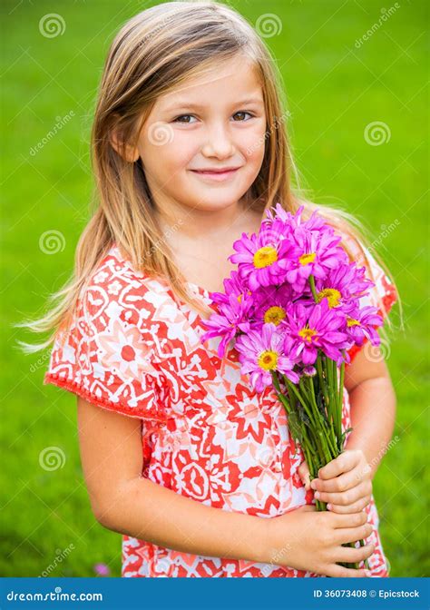 Portrait of a Smiling Cute Little Girl with Flowers Stock Photo - Image ...