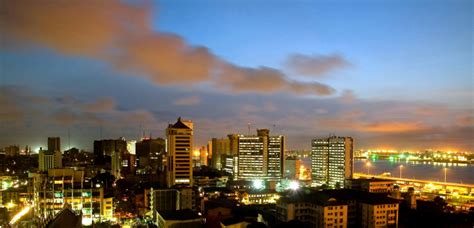 Lagos Skyline at Night with Bright Lights and Clouds