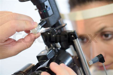 woman having eye test at eye test machine | Stock image | Colourbox