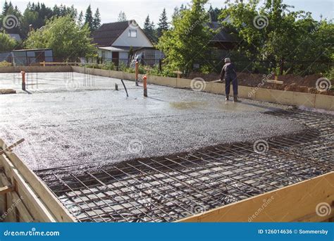 Worker Leveling Fresh Concrete Slab with a Special Working Tool Stock ...