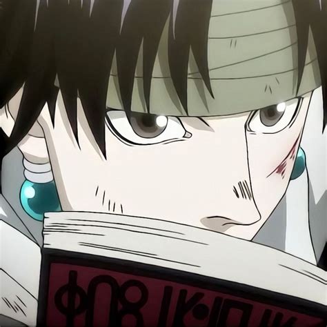 an anime character is reading a book with his eyes wide open and ...