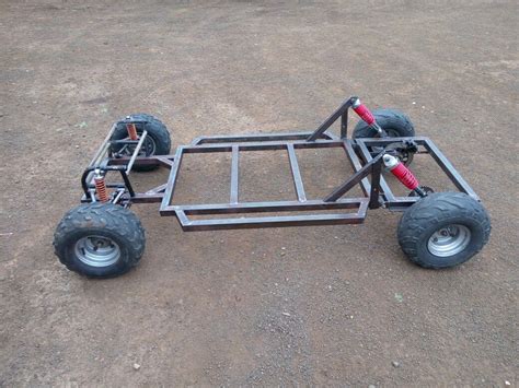 an off road vehicle with four wheels on the ground