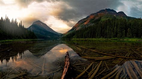 Landscape View Of Mountains Under White Black Clouds Sky Reflection On ...