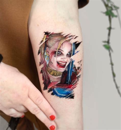 Harley Quinn portrait tattoo located on the inner