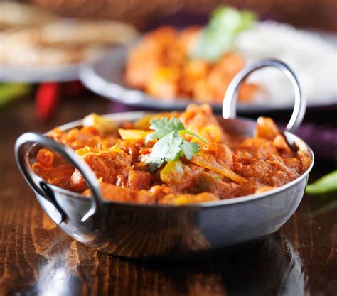 Download A Bowl Of Indian Food On A Table | Wallpapers.com