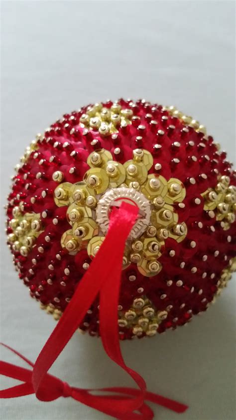 Red and gold beads and sequins. | Christmas gift decorations, Christmas ...