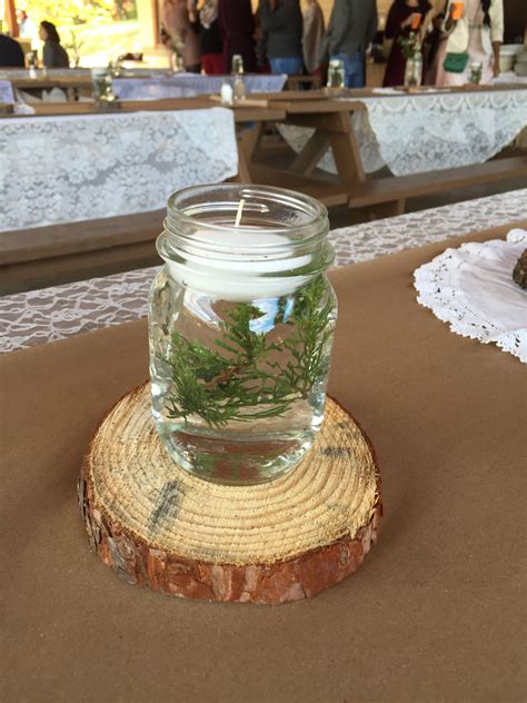 So simple mason jar centerpiece: floating greenery and candle Mason Jar ...