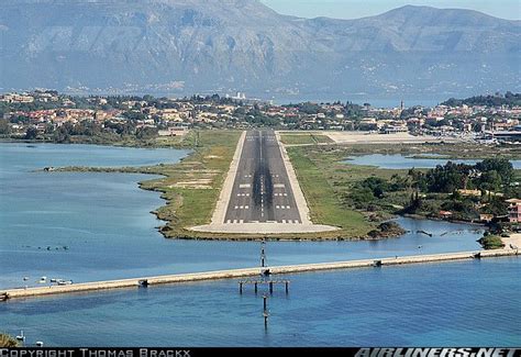 an aerial view of the tarmac and runway from above, with mountains in ...