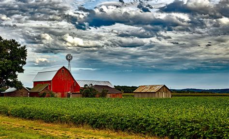 Houses in Farm Against Cloudy Sky · Free Stock Photo