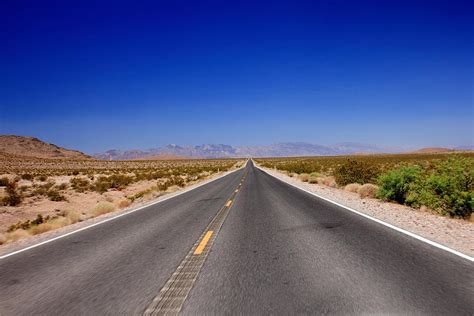 Paved Road In Rural Landscape by Felix Behnke