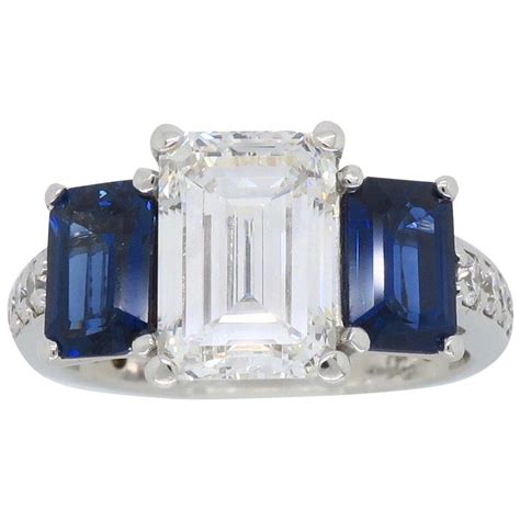 Emerald Cut Diamond and Blue Sapphire Three-Stone Engagement Ring For ...