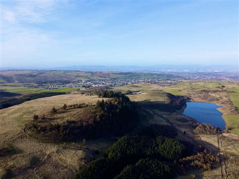 Neilston Pad, overlooking the town of Neilston and Glasgow further on ...