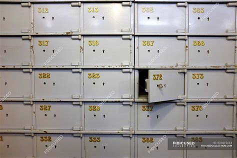 Closeup view of Numbered safe deposit boxes — indoors, abundance ...