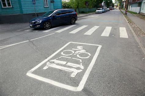 Road surface markings direct the attention of motorists and cyclists to ...