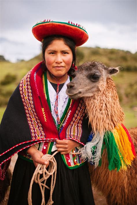 Peruvian woman in traditional clothes with a llama. Travel in the ...