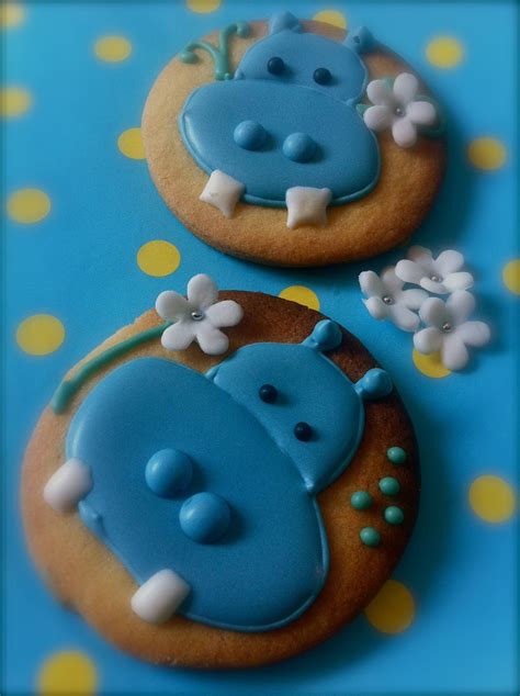 two decorated cookies with animals on them