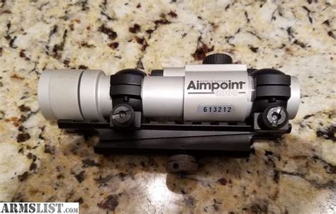 ARMSLIST - For Sale: Aimpoint 3000 w/low mount rings & carry handle rail