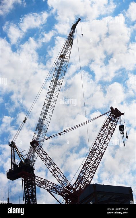 Cranes at construction site Stock Photo - Alamy