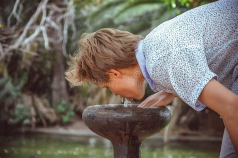 Boy Drinking at Water Fountain Stock Image - Image of water, drink: 8926171