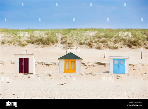 houses on the beach with blue sky Stock Photo - Alamy