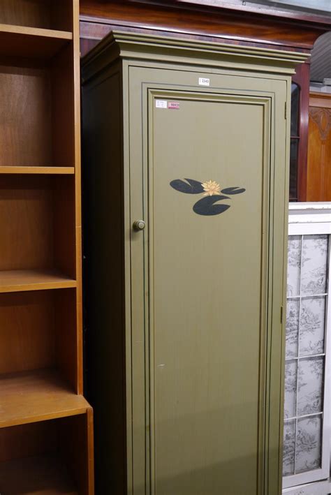 A green painted single door wardrobe