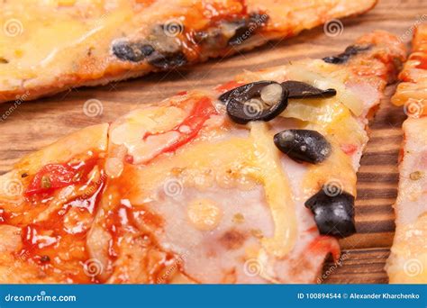 Top View of Pizza Slices with Tomato, Black Olives, Ham and Onion on a ...