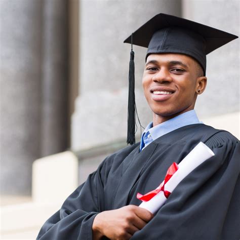 african american male graduate standing outside college - Launch ...