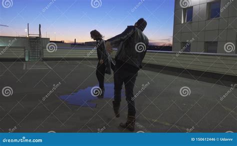 Guy in Jacket and Another Guy Dressed Like Woman are Turning Around in ...