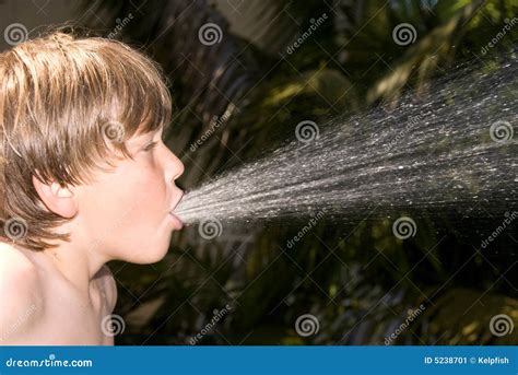 Boy Spitting Water Stock Image - Image: 5238701