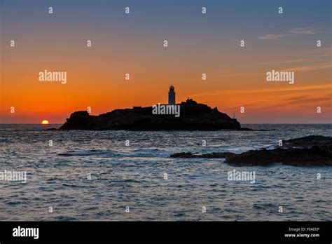 Sunset Over Godrevy Lighthouse Stock Photo - Alamy