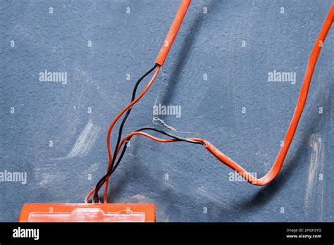 Old red wires connection system to fire alarm, close-up Stock Photo - Alamy