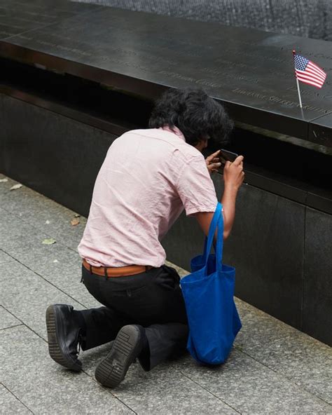 The Visitors at the 9/11 Memorial, in Photographs