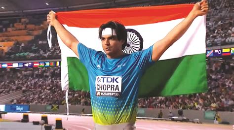 Javelin superstar Neeraj Chopra triumphantly holds the Tricolour after ...