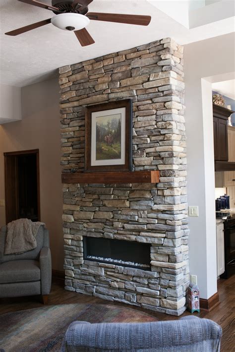 custom stacked stone fireplace - Pinnacle Homes, Inc.