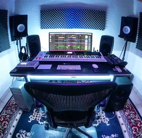 EDM studio with lights, a white midi keyboard and nice desk ...