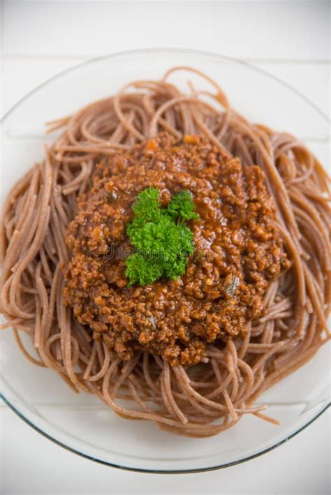 Whole Grain Spaghetti Bolognese Stock Image - Image of garnish, leaf ...