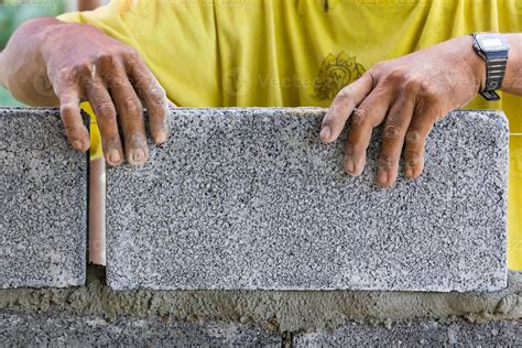 Bricklayer in working 11820317 Stock Photo at Vecteezy