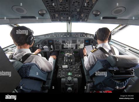 pilots in the cockpit of the KBX, Fokker 70 of the Dutch Government ...