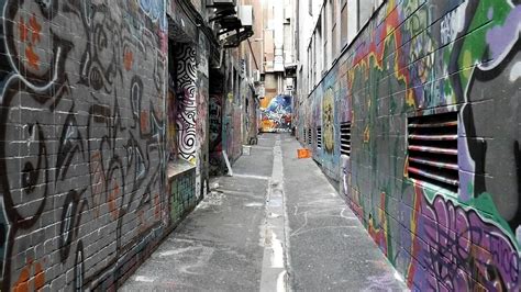 An Alleyway Full of Graffiti Art on Wall · Free Stock Video