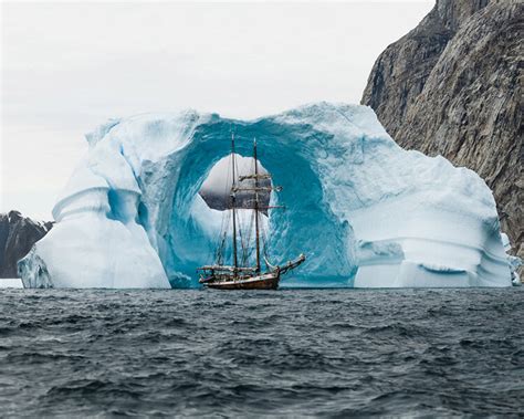 Photographer Captures Amazing Shot Of Ship In Front Of Iceberg